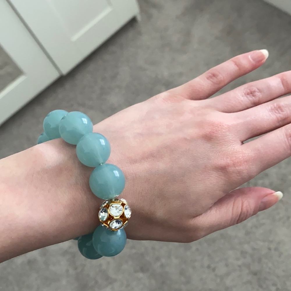 Aqua color bracelet with gold/crystal bead
